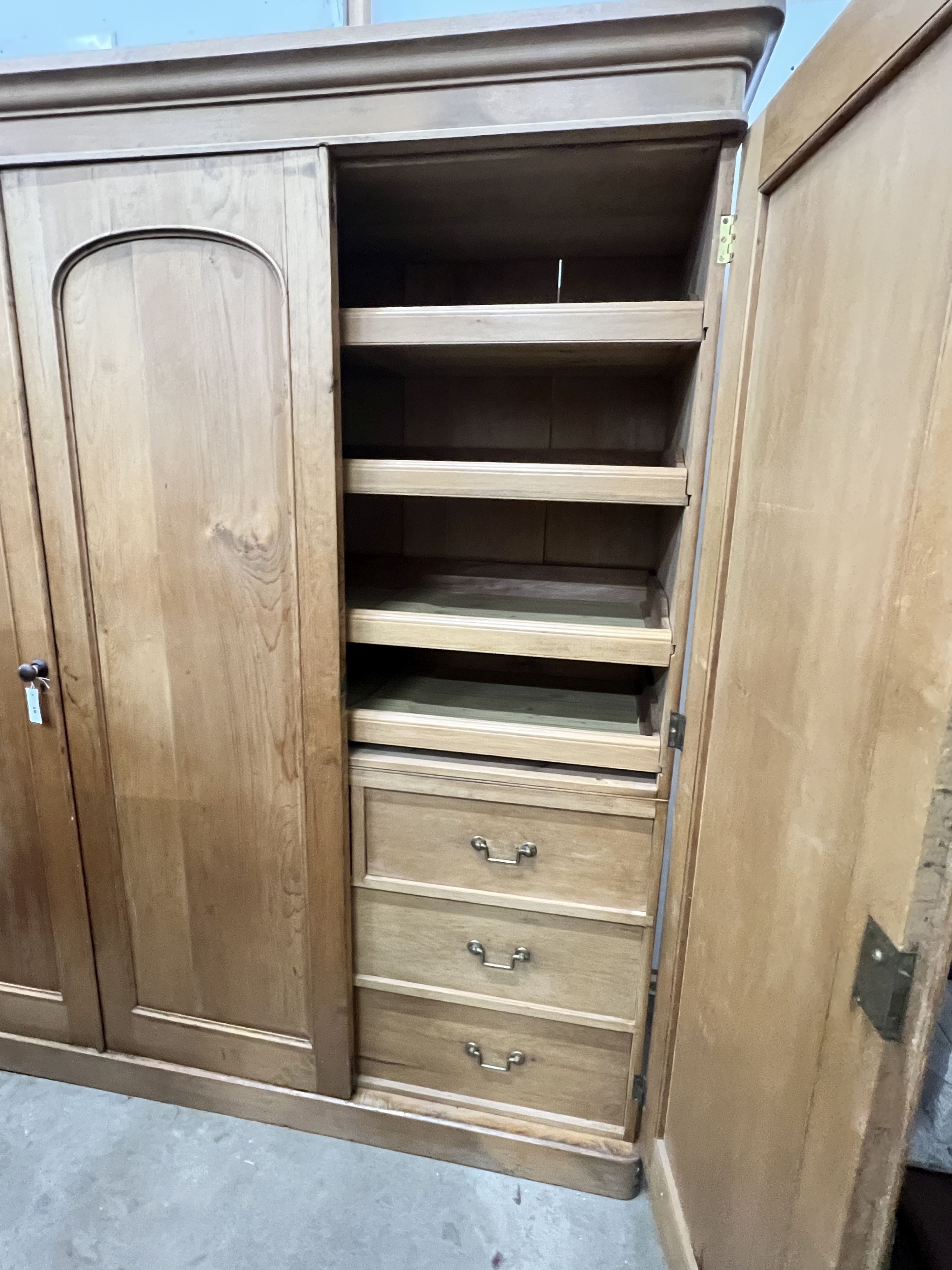 A Victorian pine compactum triple wardrobe, width 188cm, depth 60cm, height 205cm